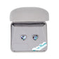 Heart-shaped earrings in a gray jewelry box with 'Wild Pearle' branding.