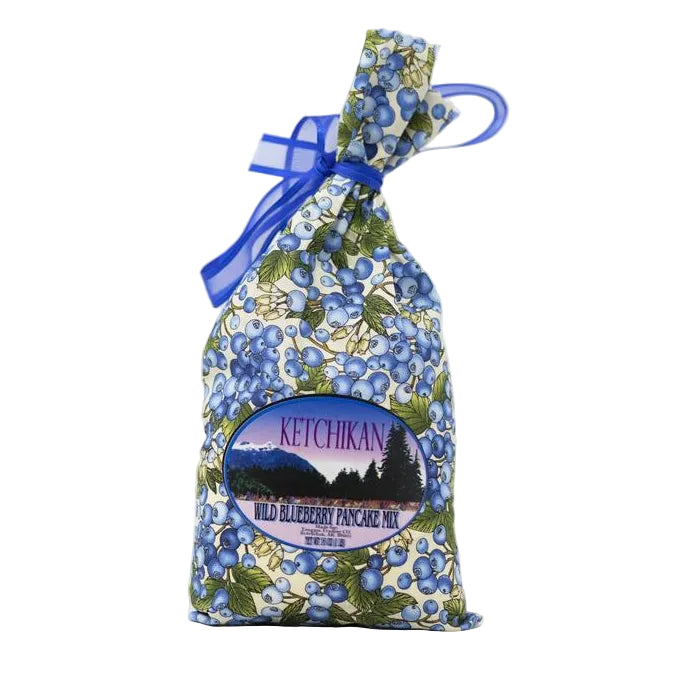 Bag of Ketchikan Wild Blueberry Pancake Mix with blue ribbon on a white background