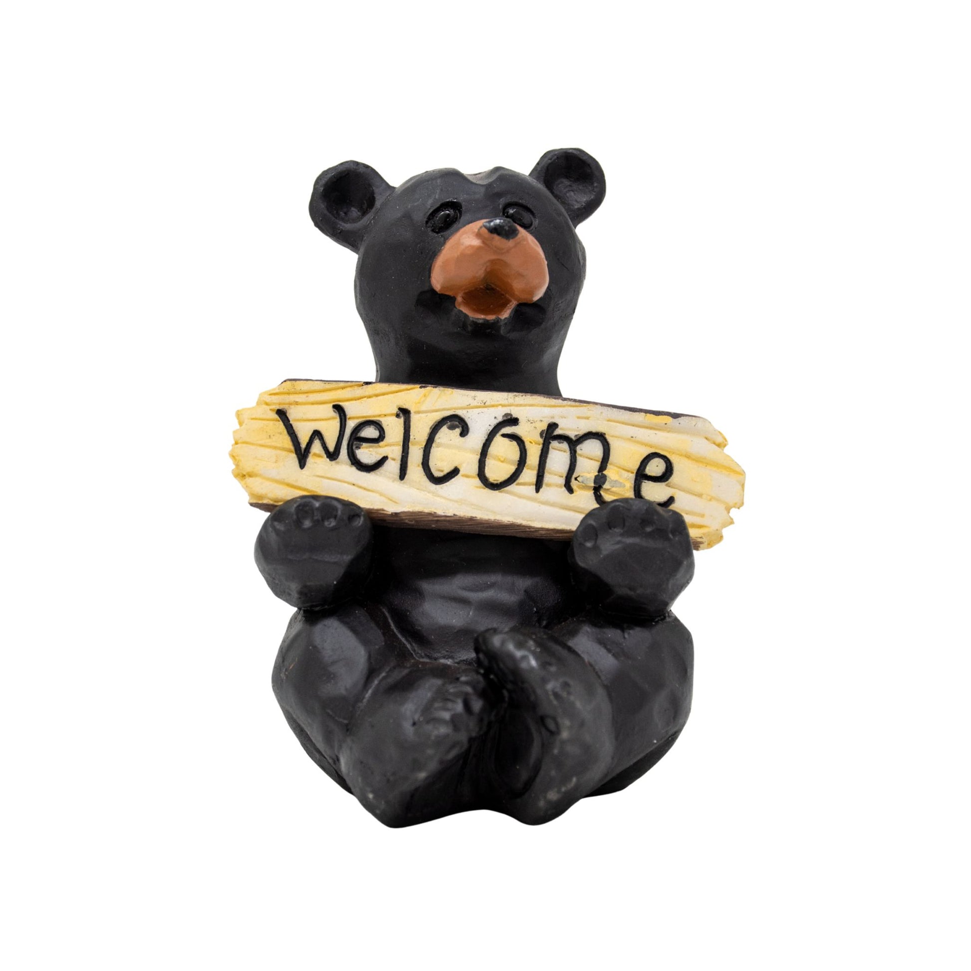 Bear figurine holding a welcome sign