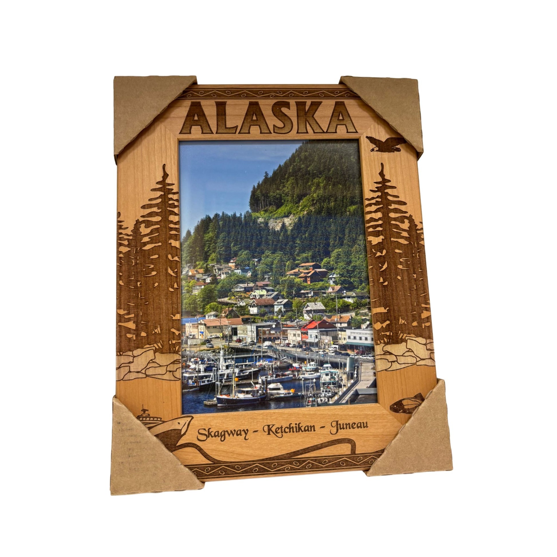 Wooden picture frame with 'Alaska' text and scenic view of a harbor.