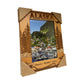Wooden frame with 'Alaska' text and scenic view of a harbor.