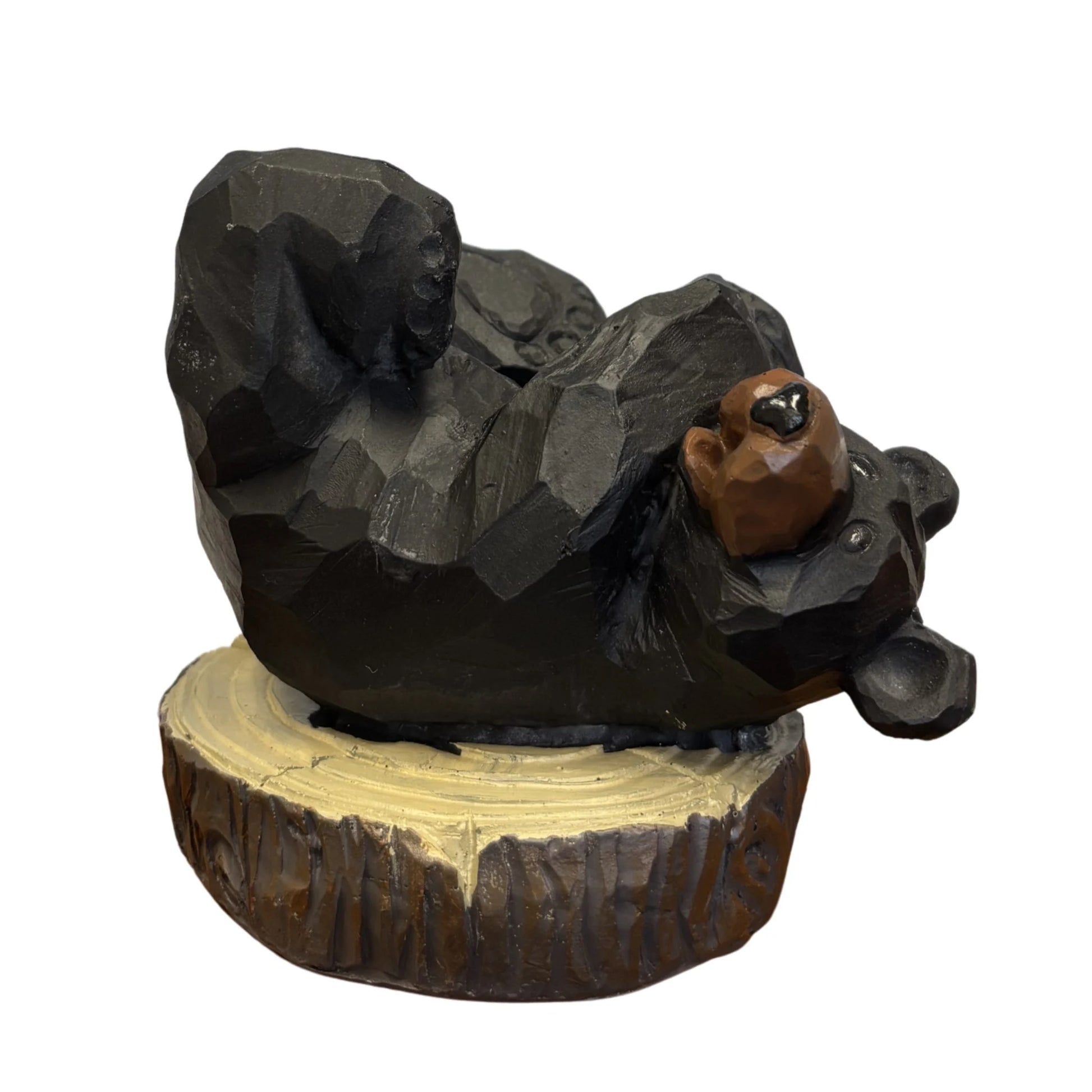 Bear wine holder sitting on a tree stump