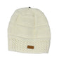 White knit beanie with a brown Alaska patch on a white background