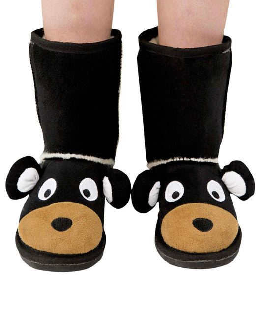 Black bear-themed slippers worn by a person on a white background