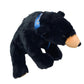 Black stuffed bear with a blue tag on a white background