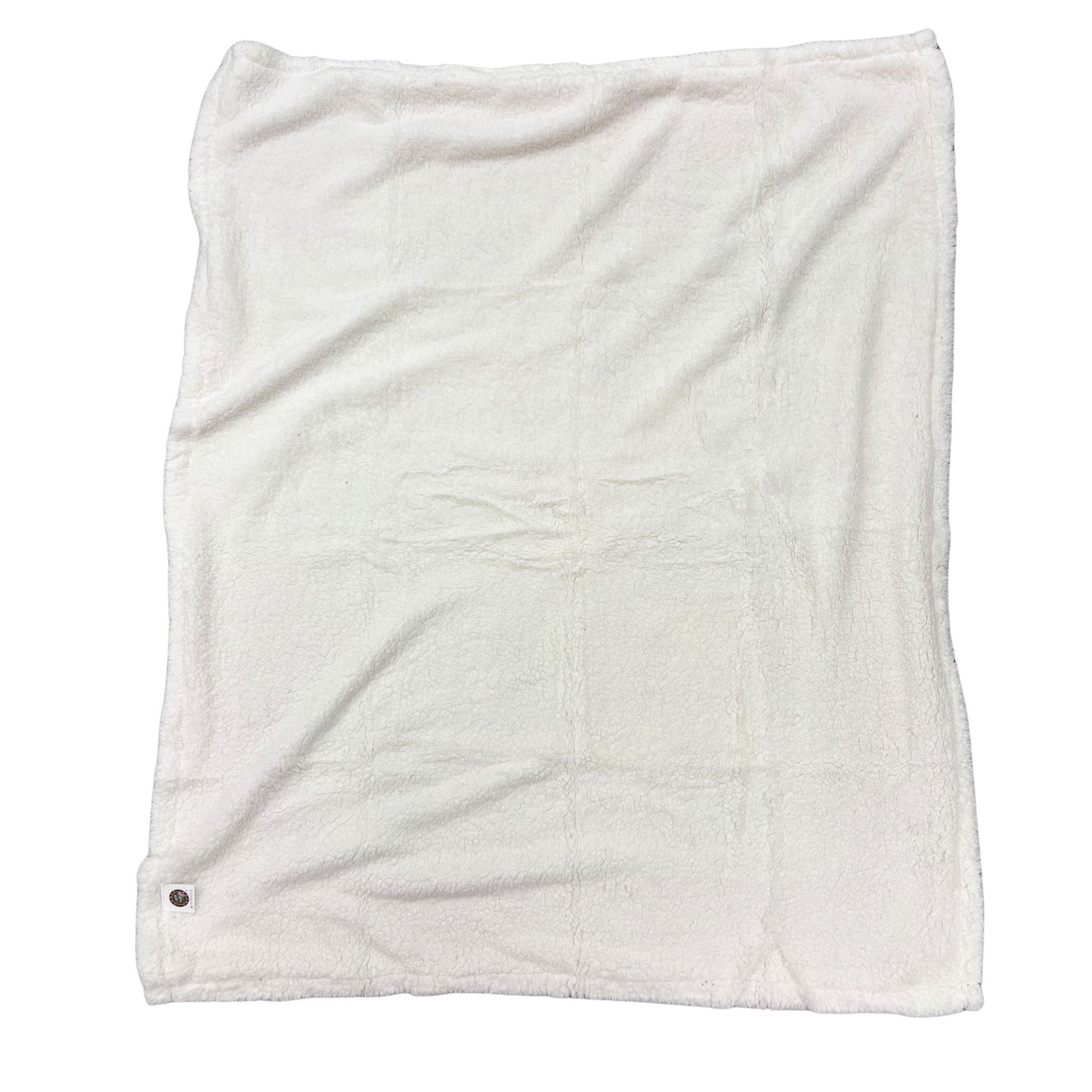 Back side of a throw blanket with soft white material