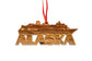 Wooden ornament shaped like a cruise ship with 'Alaska' text 