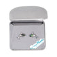 Orca-shaped earrings in a gray jewelry box with 'Wild Pearle' branding.
