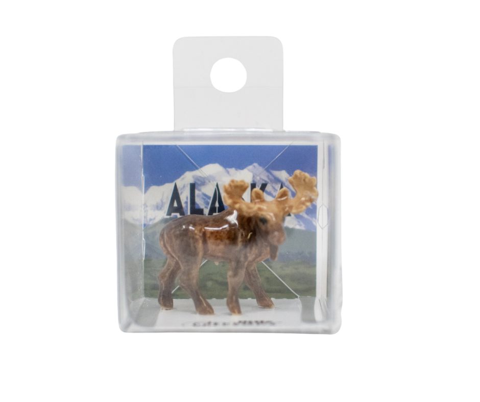 Small figurine of a moose in a clear packaging with 'Alaska' text and mountain background.