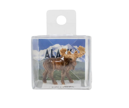 Small figurine of a moose in a clear packaging with 'Alaska' text and mountain background.