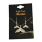 Silver whale tail necklace and earrings on a 'A Gift From Alaska' card.