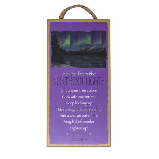 Decorative sign with Northern Lights design and text on a purple background