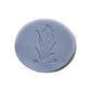 Round soap bar with a floral engraving 