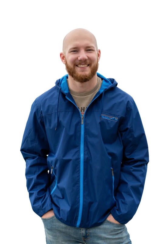 Man wearing a blue jacket with a white background