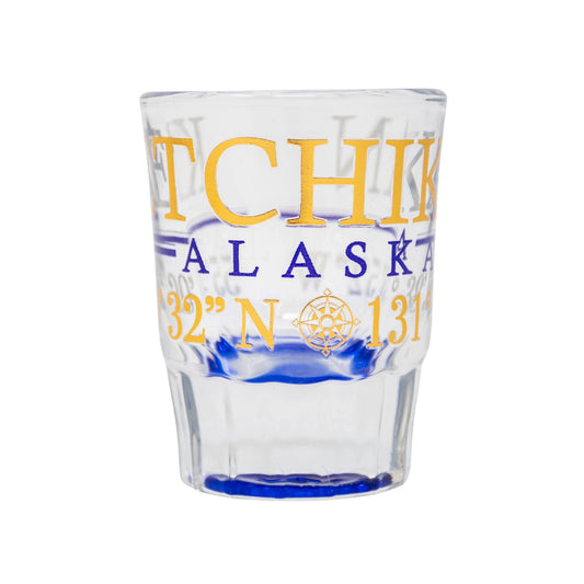 Clear glass with yellow and blue text on a white background