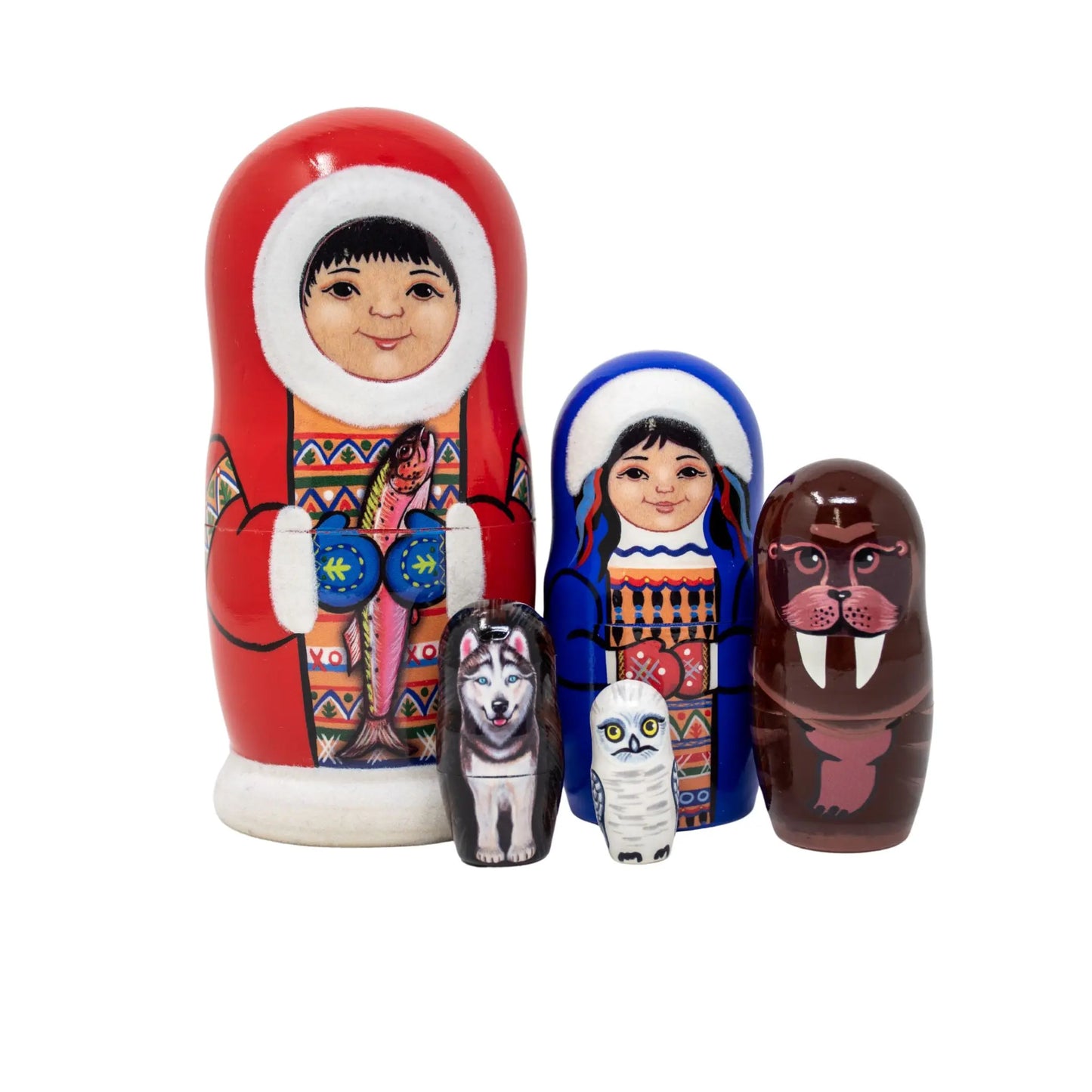 Set of four nesting dolls with walrus, owl, wolf, and Eskimo designs