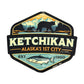 Magnet with Ketchikan Alaska's 1st City Est. 1900 text and bear and fish design