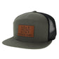 Green hat with a brown patch with fish on it