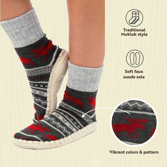 Gray mukluk with red moose pattern worn with white shoes on a beige background