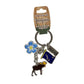 Keychain with moose, flower, and Alaska flag charm on a white background