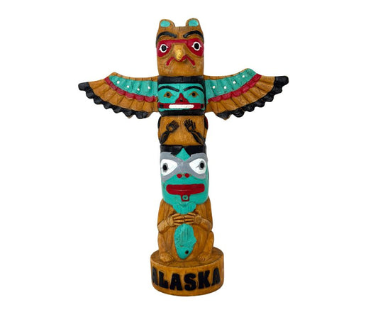 Colorful totem pole figurine with 'Alaska' on a white background