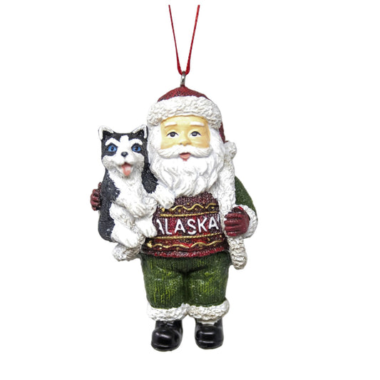 Santa Claus ornament holding a husky, wearing an 'Alaska' sweater