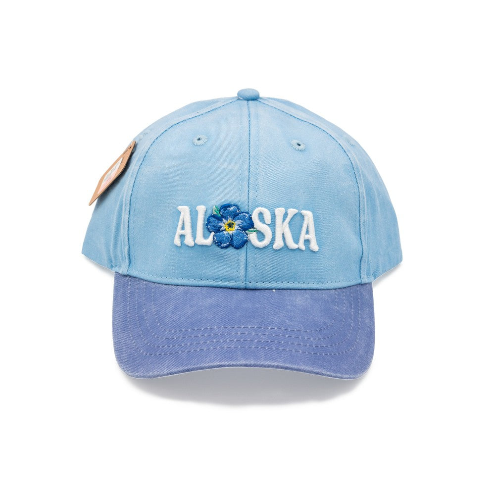 Light blue cap with 'Alaska' and flower design on a white background