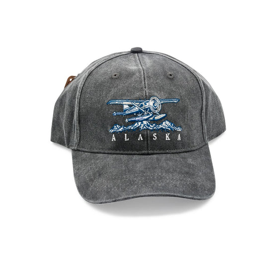 Gray cap with airplane and mountain design and 'Alaska' text on a white background