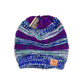 Multicolored knit beanie with brand tags on a white background