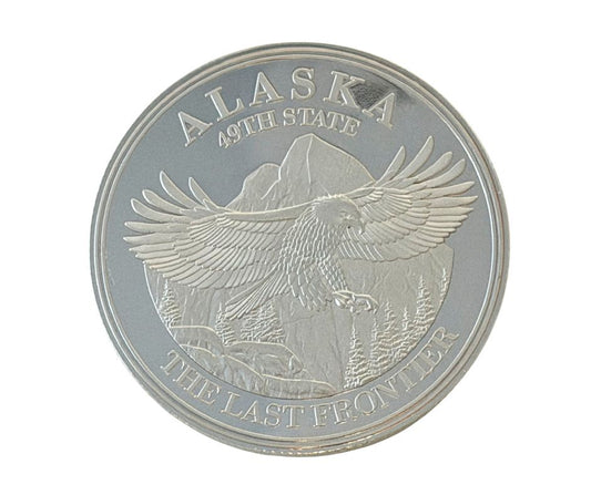 Silver coin featuring an eagle and 'Alaska 49th State' text 