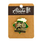 Pin with steam locomotive design on a card labeled 'Alaska Outpost'