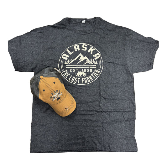 Gray t-shirt with 'Alaska The Last Frontier' design and a tan cap on a white background