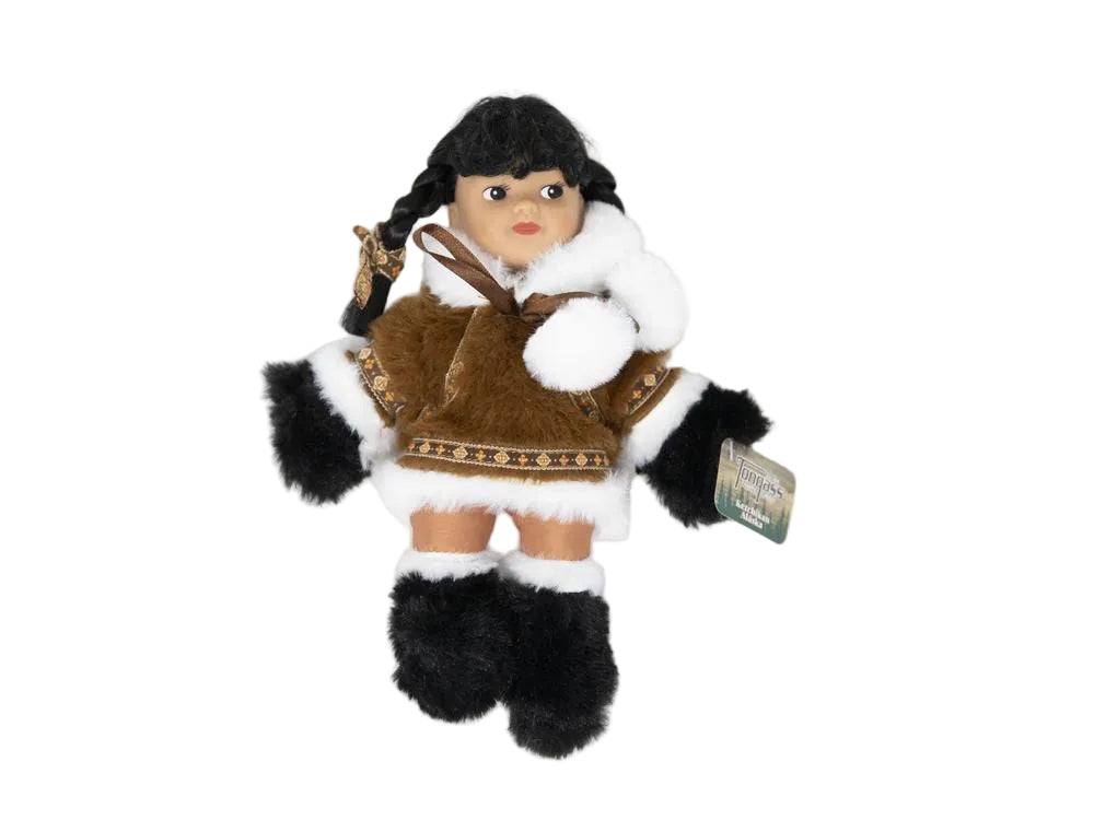 Doll toy in traditional outfit with a tag on a white background