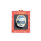 Collectible brass ornament in packaging with 'Timeless' branding