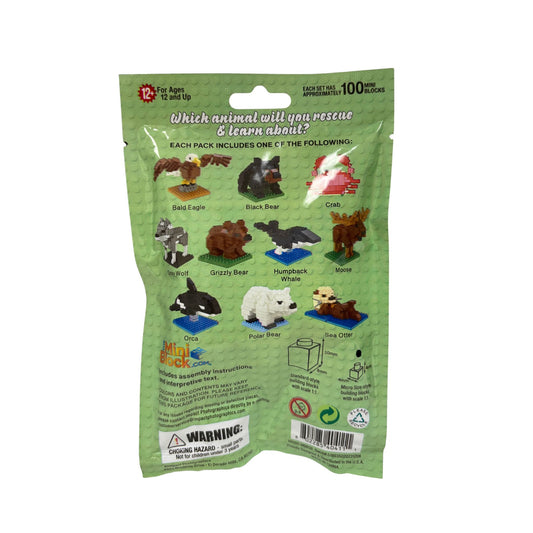 Packaged toy animal blocks with a green background