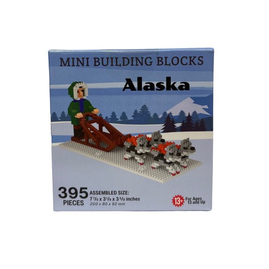 Box of mini building blocks themed 'Alaska' with a sled dog scene.