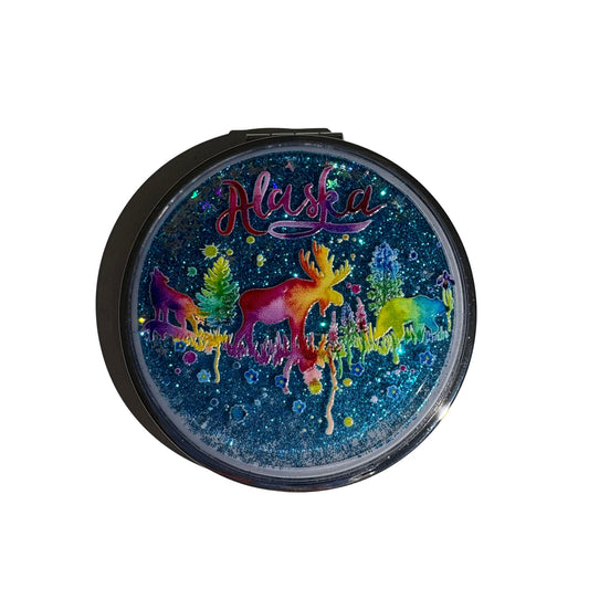 Compact mirror with colorful moose design and 'Alaska' text on a white background