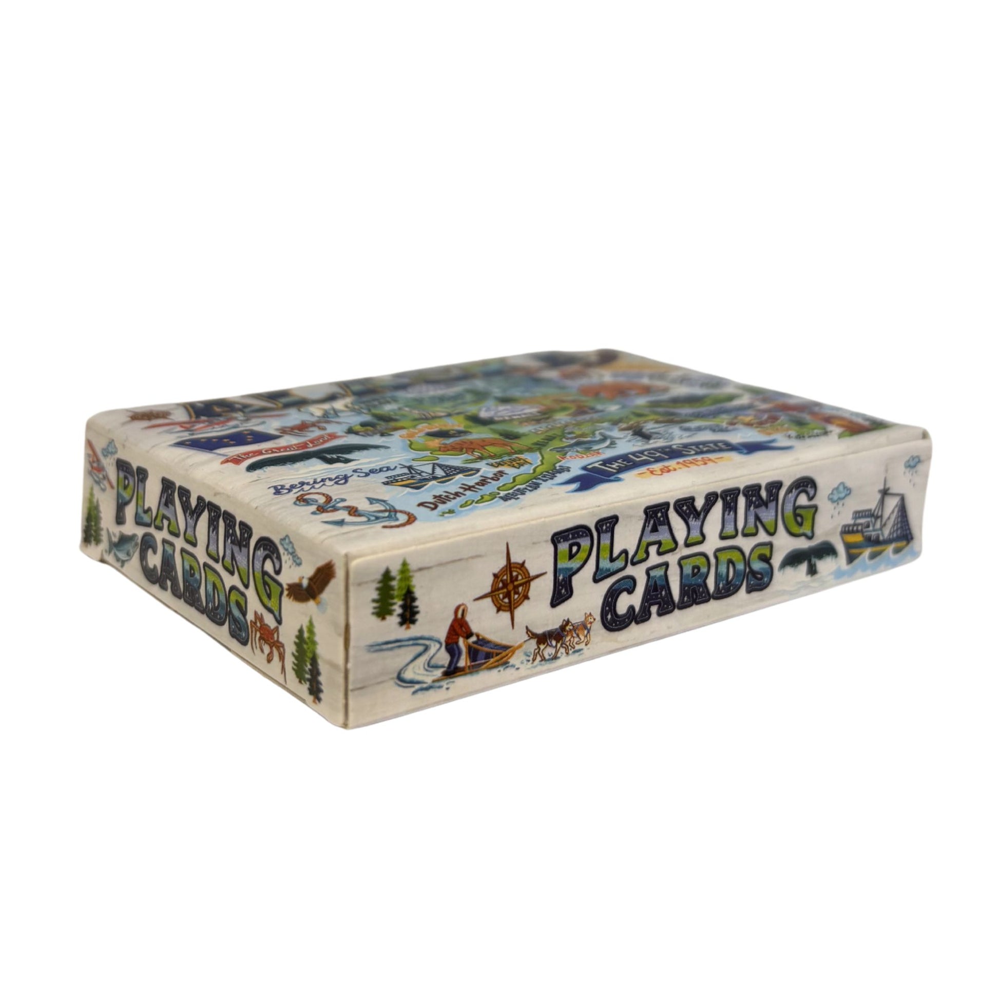 Playing card box with nature-themed design on a white background