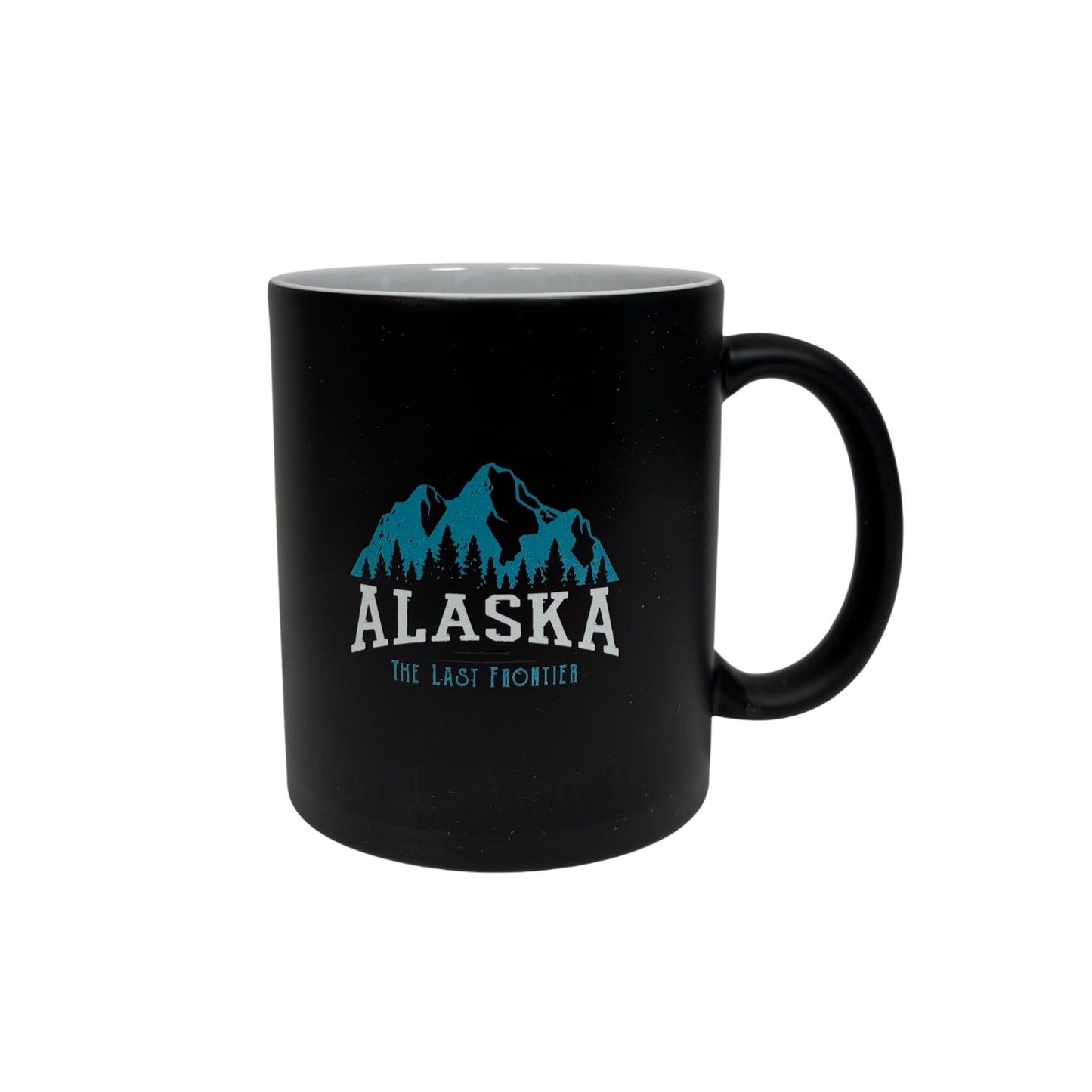 Black mug with blue mountain graphic and 'Alaska The Last Frontier' text 
