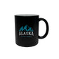 Black mug with blue mountain graphic and 'Alaska The Last Frontier' text 