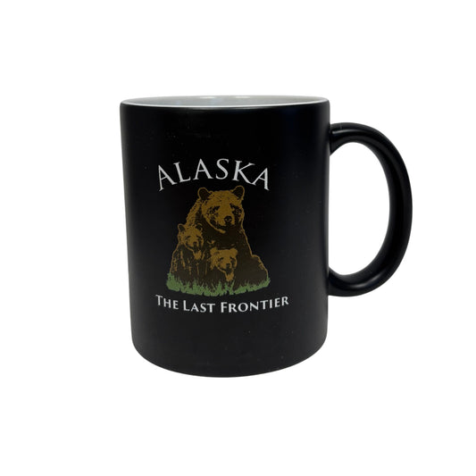 Black mug with bear design and 'Alaska The Last Frontier' text 