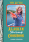 Cookbook cover featuring a woman holding shrimp with a scenic background