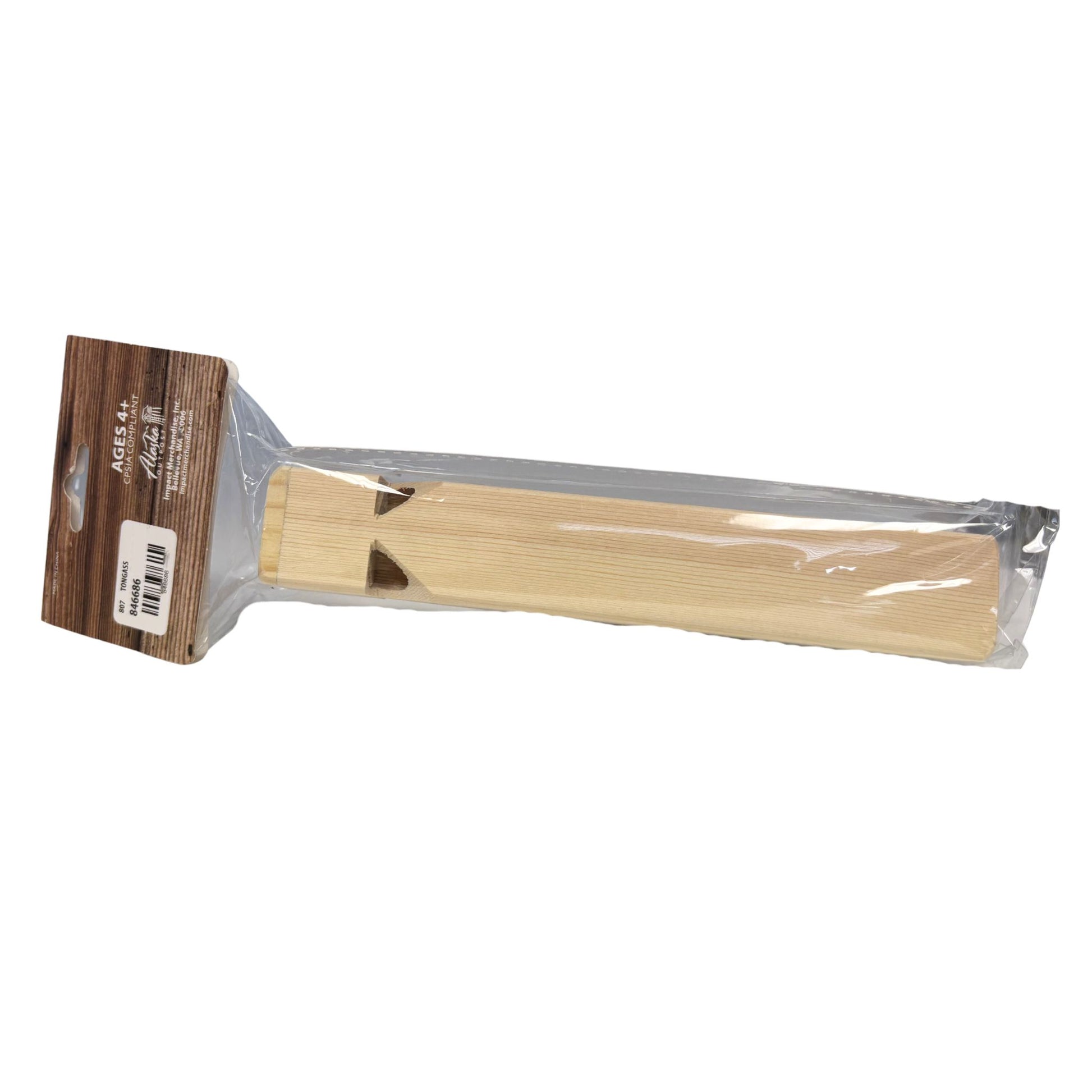 Wooden whistle in clear packaging on a white background
