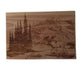 Wooden cutting board with engraved landscape and moose design, featuring the word 'Alaska'.
