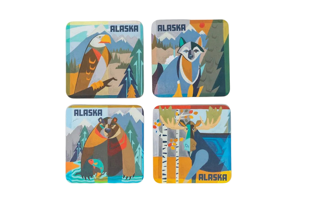 Four coasters with Alaska-themed illustrations of animals and landscapes on a white background.
