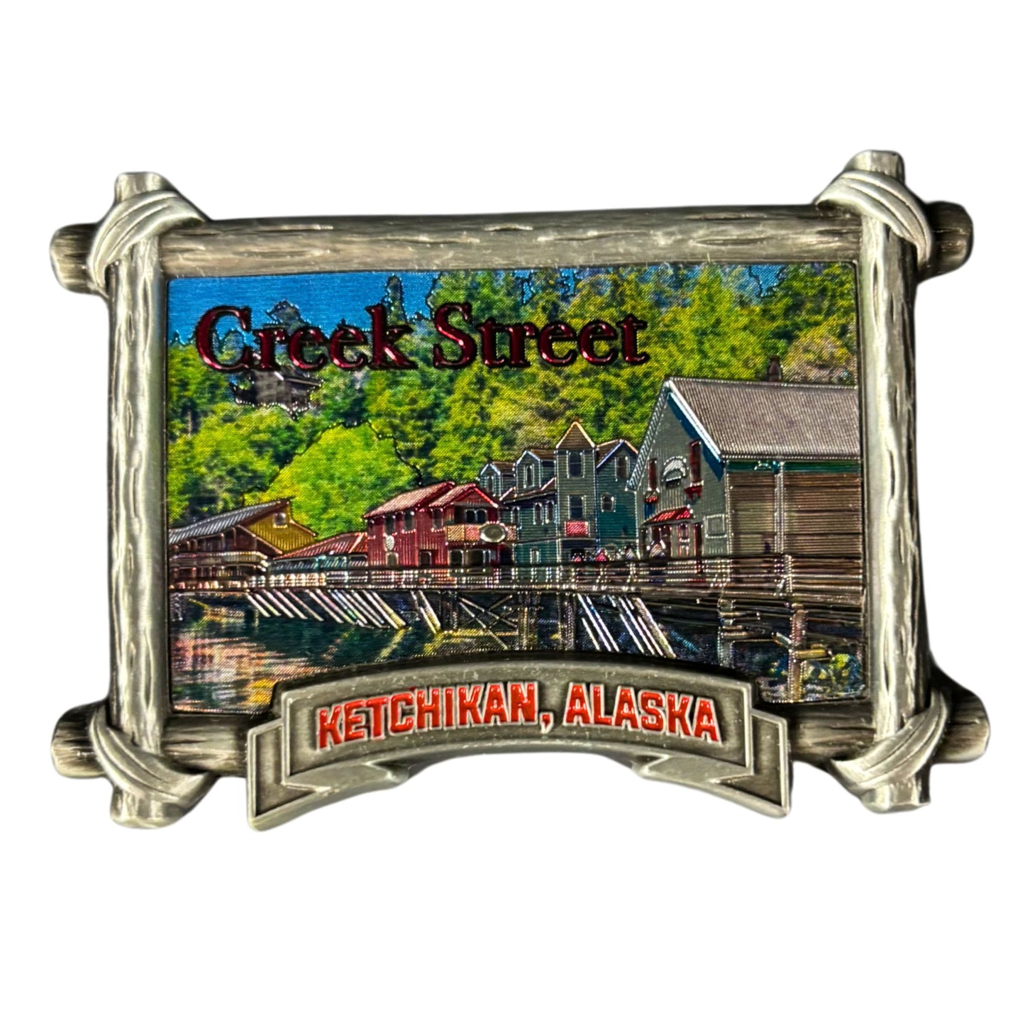 Metallic magnet with 'Creek Street Ketchikan, Alaska' text and scenic depiction.