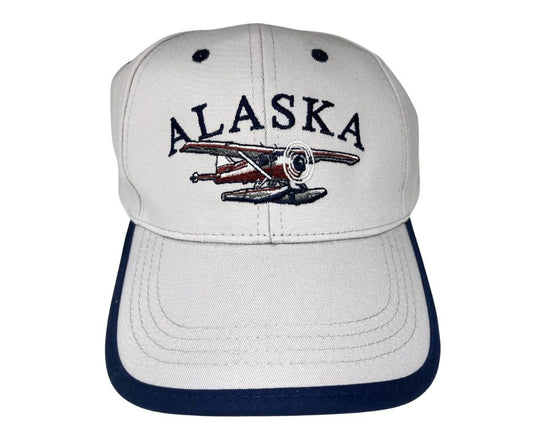White cap with 'Alaska' and a plane design on a white background