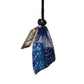 Blue dice bag with dice and a tag