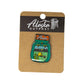 Alaska Backpack enamel pin on a cardboard backing