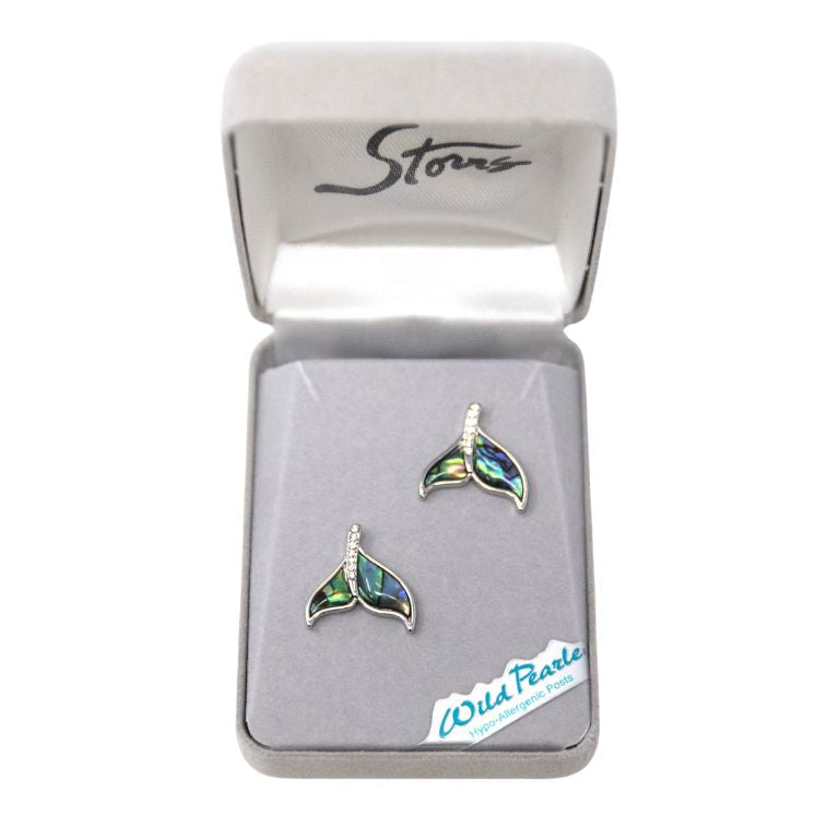 Pair of whale tail earrings in a branded box on a white background